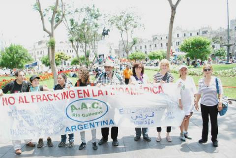 Photo: Members of civil society protest fracking in Latin America at the Peoples Climate March in Lima, Peru in December 2014. Credit: AIDA.