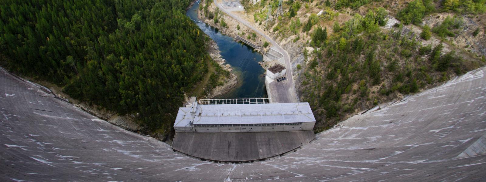 view of a large dam from atop the dam's wall