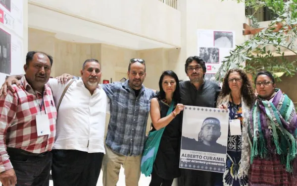 group of people holding sign for justice